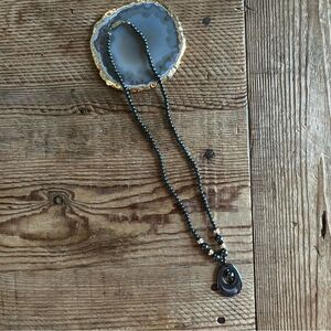 Beaded Necklace with carved copper beads and black carved stone pendant